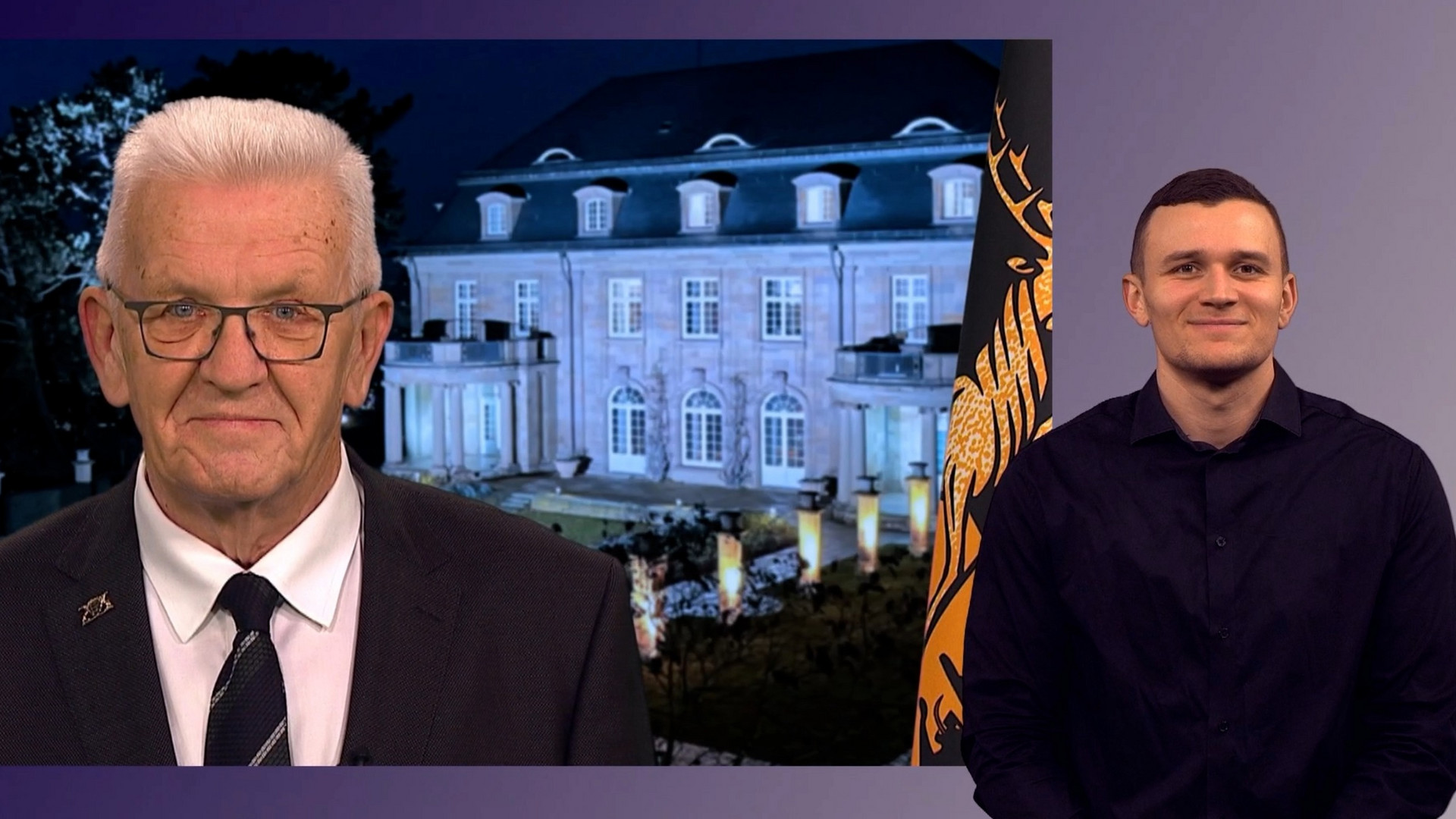Ministerpräsident Winfried Kretschmann bei seiner Ansprache zum Jahreswechsel 2025/2026, im Hintergrund die Villa Reitzenstein, rechts im Bild ein Gebärdendolmetscher.
