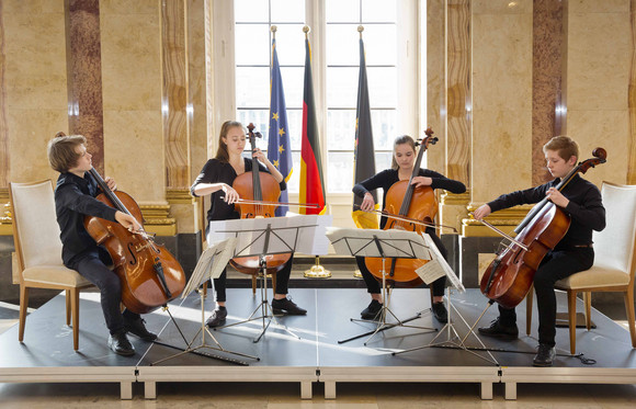 Musikalische Darbietung eines Celloquartetts